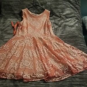 This is a coral colored dress.